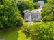 This aerial view shows the home with a large lawn and wooden fence at 305 Overland Trl, Temple, GA 30179