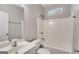 Compact bathroom features a vanity, mirror, toilet, and a shower-tub combo at 305 Overland Trl, Temple, GA 30179