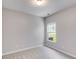 This carpeted bedroom features neutral walls, one window, and a ceiling light at 305 Overland Trl, Temple, GA 30179