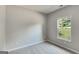 Neutral bedroom with a window view of greenery and a neutral color scheme at 305 Overland Trl, Temple, GA 30179