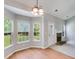 Cozy dining area with a fireplace and bright bay windows offering a pleasant view at 305 Overland Trl, Temple, GA 30179