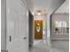 Neutral-toned entryway with view of the front door and sidelight window at 305 Overland Trl, Temple, GA 30179