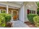 Inviting front door with stone accents, a decorative wreath, and a 'Welcome' sign at 305 Overland Trl, Temple, GA 30179