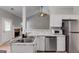 Well-equipped kitchen with stainless steel appliances and an open layout to the living area at 305 Overland Trl, Temple, GA 30179