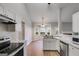 Open kitchen with stainless steel appliances and plenty of counter space perfect for cooking at 305 Overland Trl, Temple, GA 30179