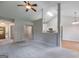 Bright living room with neutral walls, carpet, and a view of the kitchen at 305 Overland Trl, Temple, GA 30179