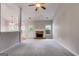 Living room with carpet, a fireplace, and access to the backyard at 305 Overland Trl, Temple, GA 30179