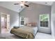 Spacious main bedroom with ample natural light, a ceiling fan, and neutral decor at 305 Overland Trl, Temple, GA 30179
