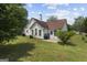 Backyard with a well maintained lawn and exterior of the house at 8180 Chapman Ter, Mcdonough, GA 30252
