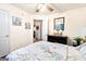 Bedroom featuring floral bedspread, light-colored walls and dark wood floors at 8180 Chapman Ter, Mcdonough, GA 30252