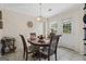 Dining room featuring chandelier, and backyard access at 8180 Chapman Ter, Mcdonough, GA 30252