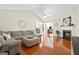 Spacious living room features vaulted ceilings, a cozy fireplace, and hardwood floors at 8180 Chapman Ter, Mcdonough, GA 30252