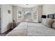 Bright main bedroom featuring hardwood floors and a cozy window seat at 8180 Chapman Ter, Mcdonough, GA 30252