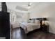 Inviting main bedroom featuring a trey ceiling, hardwood floors, and bright bay windows at 8180 Chapman Ter, Mcdonough, GA 30252