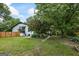 Expansive backyard featuring lush green grass, mature trees and landscaping at 98 Maddox Dr, Mcdonough, GA 30252