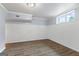 Bright basement room with modern trim and flooring and a window view, offering a versatile living space at 98 Maddox Dr, Mcdonough, GA 30252