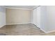 Well-lit basement area featuring modern flooring, textured walls, and a spacious closet, offering ample storage solutions at 98 Maddox Dr, Mcdonough, GA 30252