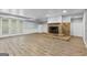 Spacious basement featuring hardwood floors, stone fireplace, and walk-out patio at 98 Maddox Dr, Mcdonough, GA 30252