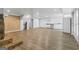 Spacious finished basement with modern flooring, stone fireplace, and a convenient kitchenette area with white appliances at 98 Maddox Dr, Mcdonough, GA 30252
