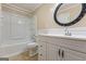Cozy bathroom featuring updated fixtures, vanity, and shower-tub combo at 98 Maddox Dr, Mcdonough, GA 30252