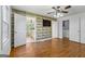 This room features wood floors and unique accent wall; it also includes an attached bathroom at 98 Maddox Dr, Mcdonough, GA 30252