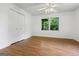 Bedroom with closet, ceiling fan, and window allowing natural light at 98 Maddox Dr, Mcdonough, GA 30252
