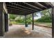 Covered patio with concrete flooring, offering an outdoor space for relaxing at 98 Maddox Dr, Mcdonough, GA 30252