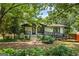 Charming single-Gathering home featuring mature landscaping and a welcoming front porch at 98 Maddox Dr, Mcdonough, GA 30252