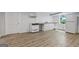 Bright kitchenette with modern appliances, countertops, and a window overlooking the backyard at 98 Maddox Dr, Mcdonough, GA 30252