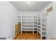 Walk-in pantry offering ample shelving and storage space at 98 Maddox Dr, Mcdonough, GA 30252