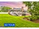 Expansive backyard featuring a multi-level deck, mature trees, and landscaped yard at 150 Old Plantation Way, Fayetteville, GA 30214