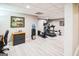 Finished basement with home gym featuring modern exercise equipment and wood-look floors at 150 Old Plantation Way, Fayetteville, GA 30214