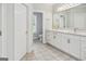 Bright bathroom with a marble-topped vanity and neutral tile flooring for a clean, modern look at 150 Old Plantation Way, Fayetteville, GA 30214