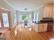Bright breakfast nook with hardwood floors, bay windows, and French doors at 150 Old Plantation Way, Fayetteville, GA 30214