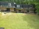 Townhome exterior with a large backyard and a quaint patio area for outdoor enjoyment at 187 Peyton Sw Pl, Atlanta, GA 30311