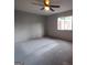 Neutral Primary bedroom with ceiling fan and window overlooking trees, awaiting your personal touch at 187 Peyton Sw Pl, Atlanta, GA 30311