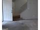 The foyer offers a view of the carpeted stairs and an open door, welcoming you into the home at 187 Peyton Sw Pl, Atlanta, GA 30311