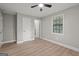 A bedroom features hardwood flooring, neutral gray walls, and natural lighting at 438 Punkintown Rd, Villa Rica, GA 30180
