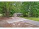 View of the home from the driveway, featuring a well-maintained front yard and cozy exterior at 438 Punkintown Rd, Villa Rica, GA 30180