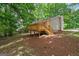 Exterior with wood deck and surrounding greenery at 438 Punkintown Rd, Villa Rica, GA 30180