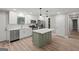 Contemporary kitchen with stainless appliances, white cabinets, island, and hardwood flooring at 438 Punkintown Rd, Villa Rica, GA 30180