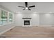 Living room with a striking stone fireplace, neutral walls, and light wood-look floors at 438 Punkintown Rd, Villa Rica, GA 30180