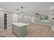 Open-concept kitchen and living room with an island and fireplace at 438 Punkintown Rd, Villa Rica, GA 30180
