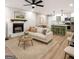 Bright and airy living room featuring a fireplace, sofa, barstools, and updated flooring at 438 Punkintown Rd, Villa Rica, GA 30180