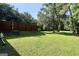 Large, well-manicured backyard with green lawn and wooden fence at 437 Mays Rd, Stockbridge, GA 30281