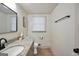 Neutral half bathroom featuring a granite countertop and sleek, modern fixtures at 437 Mays Rd, Stockbridge, GA 30281