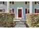 Close-up of the front door with red door, shutters, and a 'Welcome' sign at 437 Mays Rd, Stockbridge, GA 30281