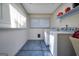 Bright laundry room featuring tile floor and newer washer and dryer at 437 Mays Rd, Stockbridge, GA 30281