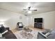 Comfortable living room with fan, plush seating, and a decorative rug for a cozy atmosphere at 437 Mays Rd, Stockbridge, GA 30281