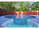 Backyard pool with built-in hot tub, surrounded by a wooden fence and lush trees at 437 Mays Rd, Stockbridge, GA 30281